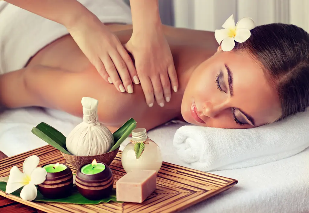 A client resting with eyes closed during a relaxing shoulder massage